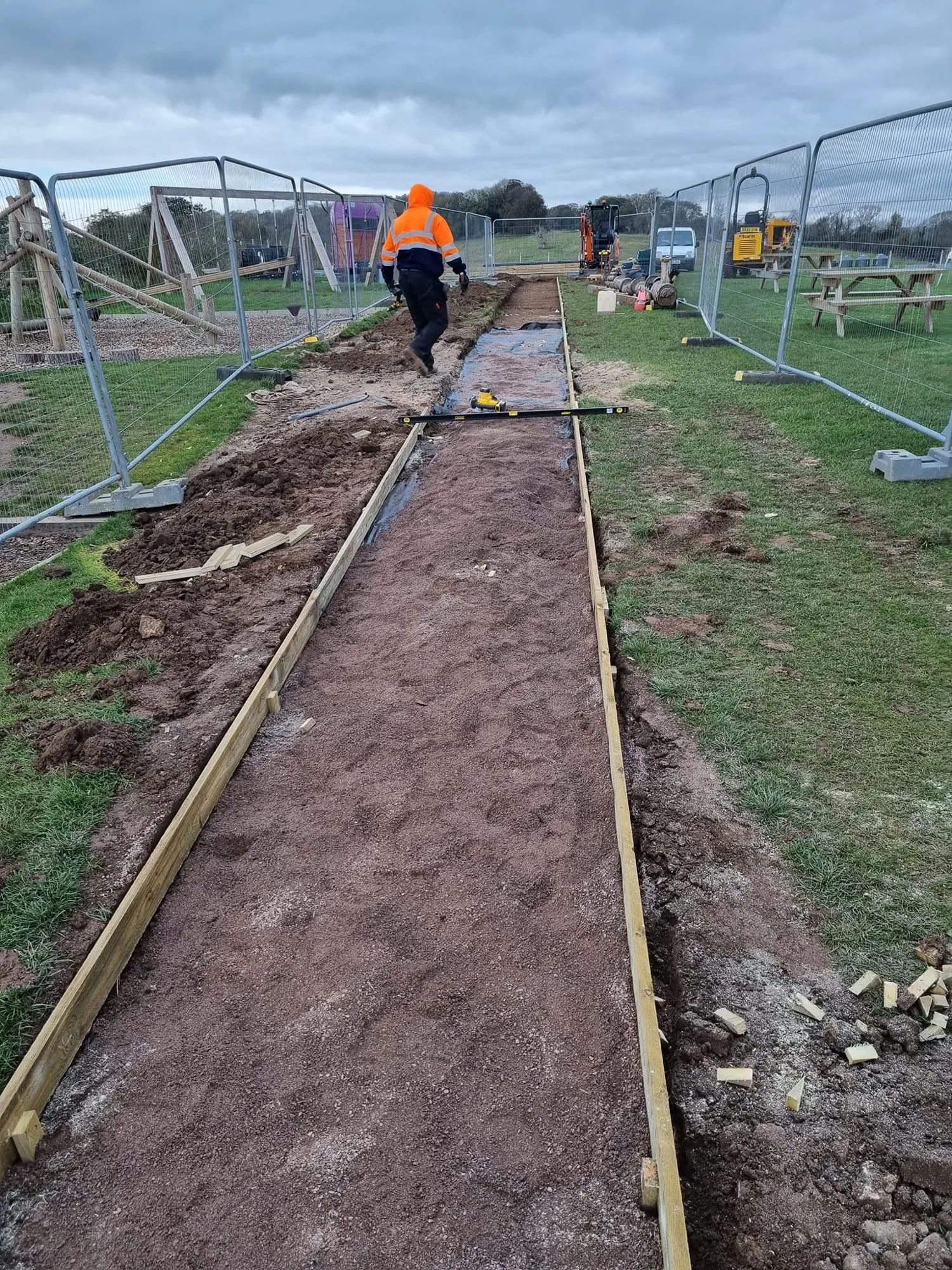 Excavated footpath with timber edging boards in place
