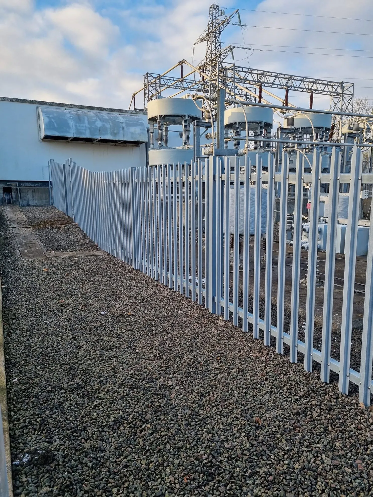 New grey palisade fence around an electricity substation