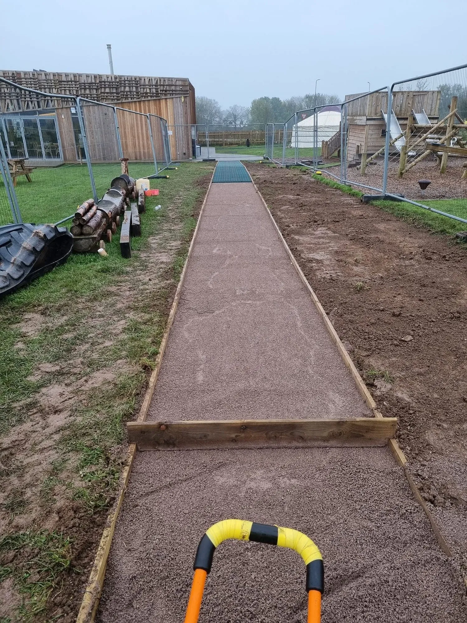 Sub-base laid between timber edging on a new footpath