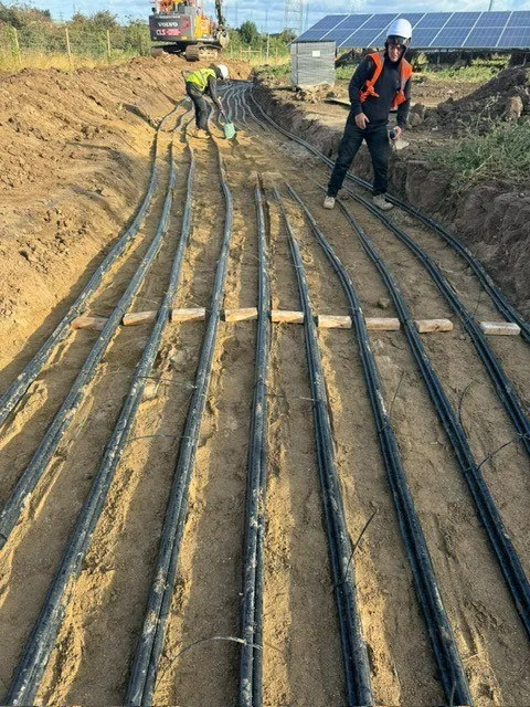 Multiple ducts laid in a trench with warning tape