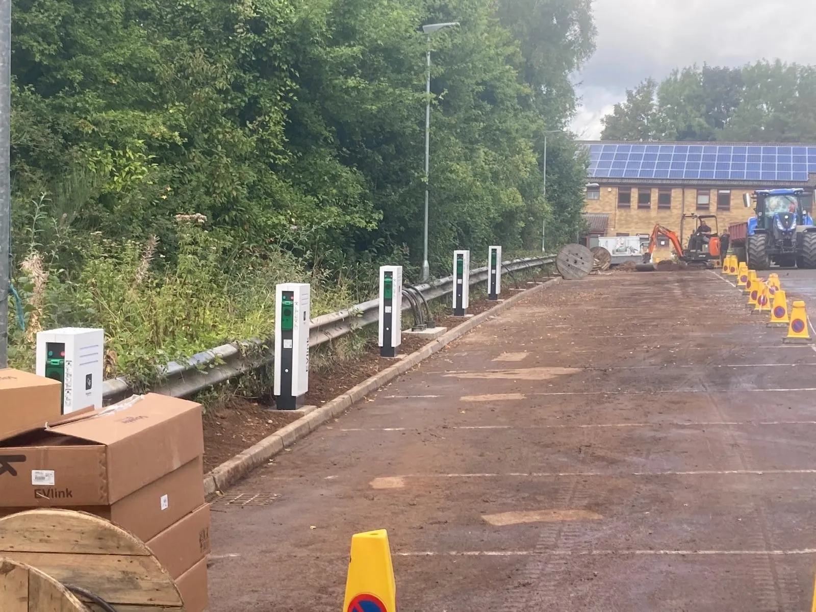 Site works with solar panels in the background
