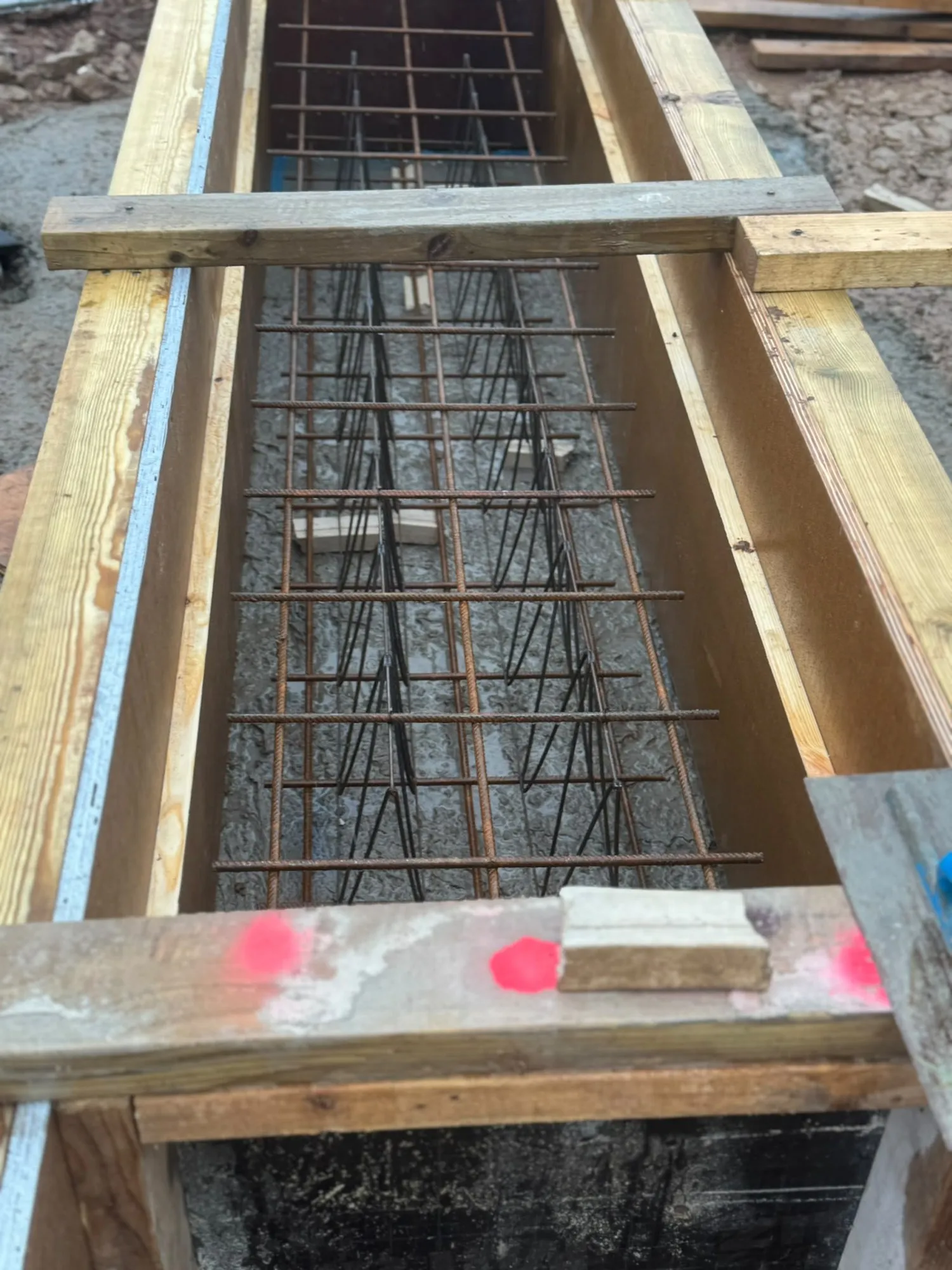 Timber formwork and rebar for a concrete chamber