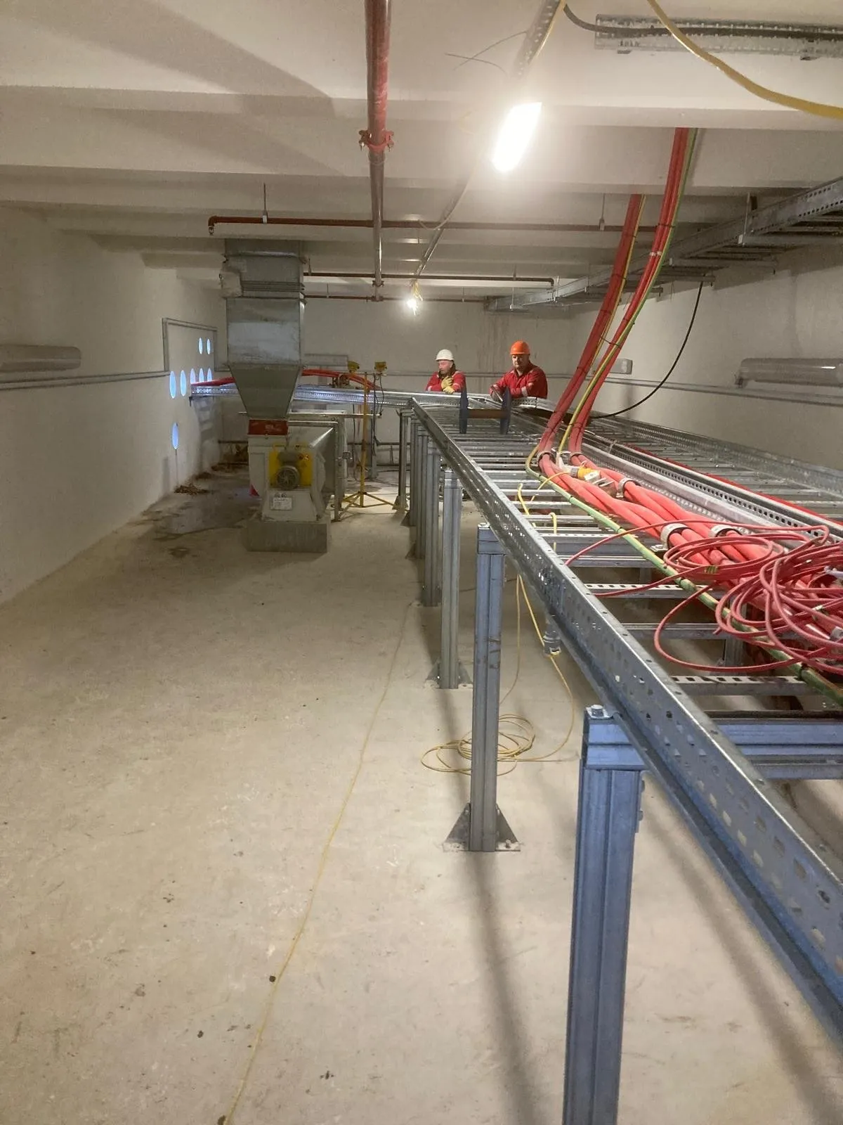 Cable racks running the length of a plant room